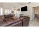 Spacious living room with tile floors and a comfortable leather sofa at 5753 Summer Side Ln # 8A, Sarasota, FL 34231