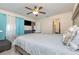 Main bedroom featuring a ceiling fan and en-suite bathroom at 5753 Summer Side Ln # 8A, Sarasota, FL 34231