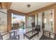 This patio features tile flooring, privacy screens, and a seating area at 5753 Summer Side Ln # 8A, Sarasota, FL 34231