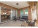 This patio features tile flooring, privacy screens, and a seating area at 5753 Summer Side Ln # 8A, Sarasota, FL 34231