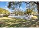 Community pool area featuring a white fence and lush green surroundings at 5753 Summer Side Ln # 8A, Sarasota, FL 34231