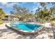Beautiful community swimming pool with clear blue water and surrounding lounge area at 5753 Summer Side Ln # 8A, Sarasota, FL 34231