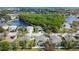 Aerial view of neighborhood showing lake, mature trees, and well-maintained homes at 5806 43Rd E Ct, Bradenton, FL 34203