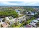 Aerial view of community showcasing lakes and trees within a neighborhood of single Gathering homes at 5806 43Rd E Ct, Bradenton, FL 34203