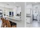 Eat-in kitchen features counter seating, stainless steel appliances, and ample white cabinetry at 5806 43Rd E Ct, Bradenton, FL 34203
