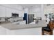 Bright kitchen features stainless steel appliances, white cabinetry, and barstool seating at 5806 43Rd E Ct, Bradenton, FL 34203