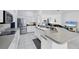 Modern kitchen features stainless appliances, breakfast bar, and seamless flow into the living spaces at 5806 43Rd E Ct, Bradenton, FL 34203