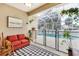 Screened lanai with outdoor seating area, checkered rug and a view of the pool at 5806 43Rd E Ct, Bradenton, FL 34203