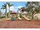 Community playground with slides, stairs and overhead cover for outdoor fun and recreation at 5806 43Rd E Ct, Bradenton, FL 34203