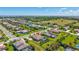High-angle view of a suburban neighborhood with beautiful homes, green spaces, and community amenities at 604 166Th E St, Bradenton, FL 34212