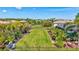 Large backyard featuring lush landscaping, a black fence, and meticulously maintained lawn at 604 166Th E St, Bradenton, FL 34212