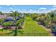Beautiful, well-manicured backyard with an iron fence and lush landscaping at 604 166Th E St, Bradenton, FL 34212