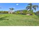 Spacious backyard featuring lush greenery, perfect for outdoor entertainment and recreation at 604 166Th E St, Bradenton, FL 34212