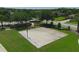 Outdoor community basketball court with green space and surrounding trees at 604 166Th E St, Bradenton, FL 34212