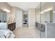 Bathroom featuring a glass enclosed shower, soaking tub, and granite countertop on the vanities at 604 166Th E St, Bradenton, FL 34212