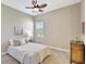 Cozy bedroom with neutral tones, a comfortable bed, and a charming wooden dresser at 604 166Th E St, Bradenton, FL 34212