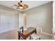 Bedroom with desk and chair, ceiling fan, closet, and neutral carpet at 604 166Th E St, Bradenton, FL 34212