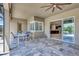 Covered patio with outdoor dining area and easy access to the kitchen and pool area at 604 166Th E St, Bradenton, FL 34212