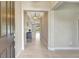 Bright and airy foyer featuring neutral walls, stylish tiled flooring, and an open floor plan leading to a welcoming space at 604 166Th E St, Bradenton, FL 34212