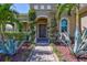 Inviting front entrance with manicured landscaping and a charming walkway at 604 166Th E St, Bradenton, FL 34212