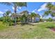 Charming single-story home with lush landscaping, well-manicured lawn, and tile roof at 604 166Th E St, Bradenton, FL 34212