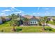 Charming home with beautiful landscaping, healthy green lawn, and a well-maintained exterior at 604 166Th E St, Bradenton, FL 34212