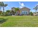Charming single-story home with a well-manicured lawn, lush landscaping, and welcoming curb appeal at 604 166Th E St, Bradenton, FL 34212