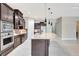 Gourmet kitchen with granite counters, stainless steel appliances, and large center island at 604 166Th E St, Bradenton, FL 34212
