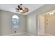 Bright living room with modern ceiling fan, neutral paint and view to the outdoors at 604 166Th E St, Bradenton, FL 34212