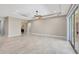 Spacious living area with tile flooring, ceiling fan, and sliding glass doors at 604 166Th E St, Bradenton, FL 34212