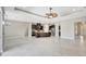Open concept living room with tile floors and an island kitchen at 604 166Th E St, Bradenton, FL 34212