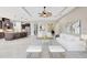 Open-concept living room featuring modern decor and seamlessly connected kitchen and dining areas at 604 166Th E St, Bradenton, FL 34212