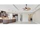 Open concept living space with tray ceilings and views of the kitchen at 604 166Th E St, Bradenton, FL 34212