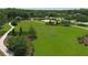 Well-maintained community park featuring lush green space, a soccer goal, and shaded picnic spots among mature trees at 604 166Th E St, Bradenton, FL 34212