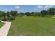 Picturesque park with lush lawn, walking path and sports equipment at 604 166Th E St, Bradenton, FL 34212