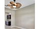 Inviting room featuring a tropical ceiling fan, neutral walls, and an adjacent doorway for an airy feel at 604 166Th E St, Bradenton, FL 34212