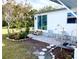 Backyard offers a brick-paver patio, lush garden, and tranquil outdoor seating area at 617 Cervina S Dr, Venice, FL 34285