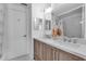 Bathroom featuring double sink vanity, modern lighting, and ample counter space at 617 Cervina S Dr, Venice, FL 34285