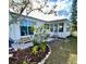 Home featuring a cozy patio area, well-maintained landscaping, and a welcoming entrance at 617 Cervina S Dr, Venice, FL 34285