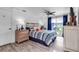 Cozy bedroom featuring a sliding glass door, ceiling fan, and coordinated décor at 617 Cervina S Dr, Venice, FL 34285