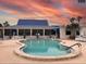 Inviting community pool with a unique design, perfect for relaxation and recreation at 617 Cervina S Dr, Venice, FL 34285