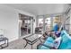Bright sunroom with comfortable seating, sliding glass doors, and plenty of natural light at 617 Cervina S Dr, Venice, FL 34285