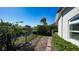 Scenic backyard view with lush greenery, water, and neighboring homes at 7340 Barclay Ct, University Park, FL 34201