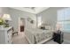 Beautifully staged bedroom with ceiling fan, ensuite bath, and neutral color scheme at 7340 Barclay Ct, University Park, FL 34201