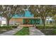 Inviting clubhouse entrance with manicured landscaping and walkway at 7340 Barclay Ct, University Park, FL 34201