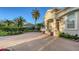 Beautiful home exterior with lush landscaping, mature palms and paver driveway at 7340 Barclay Ct, University Park, FL 34201