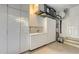 This garage has ample storage space with all white cabinets and a convenient sink at 7340 Barclay Ct, University Park, FL 34201