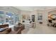 Open living space with comfortable seating, view of the pool and sliding glass doors at 7340 Barclay Ct, University Park, FL 34201