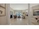 Elegant living room with tile floors, stylish furnishings and a view of the screened pool area at 7340 Barclay Ct, University Park, FL 34201