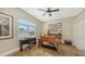 Charming home office with hardwood floors, a large window with shutters, and functional furniture at 7340 Barclay Ct, University Park, FL 34201